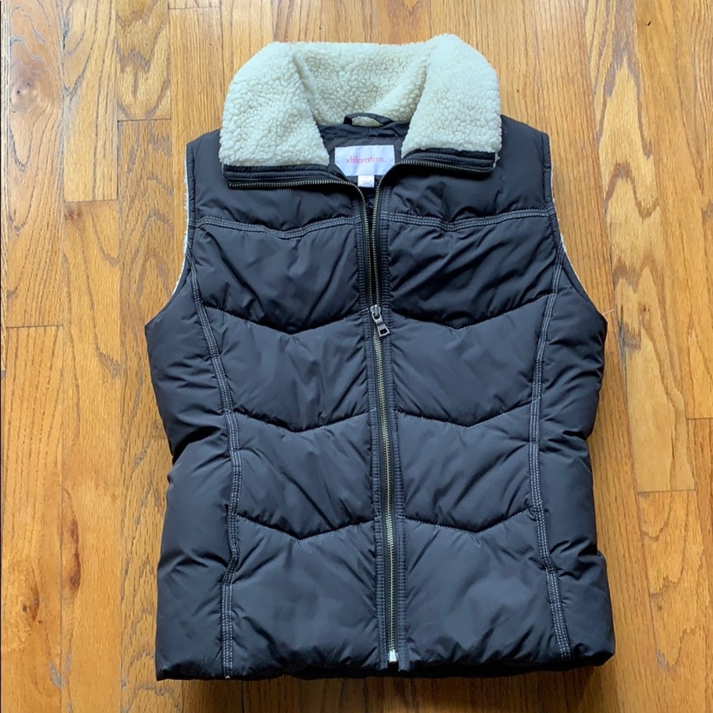 Black puffy vest with faux shearling trim